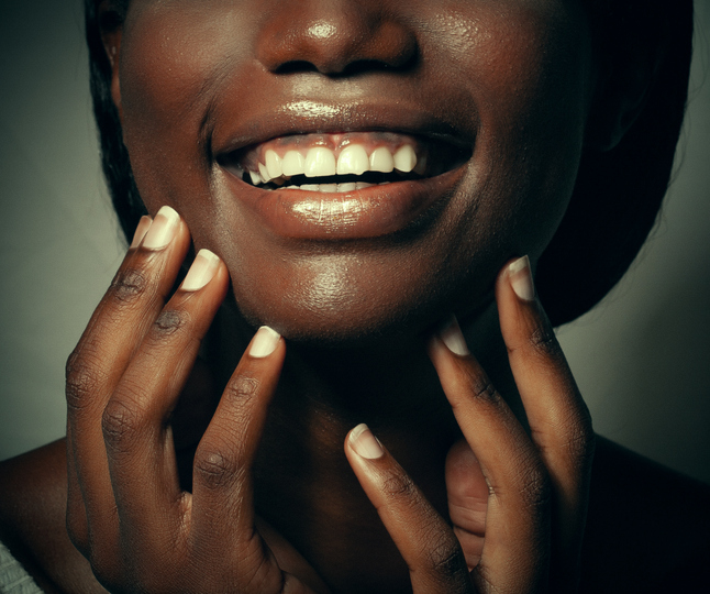 Black woman with black gums or patchy gums.